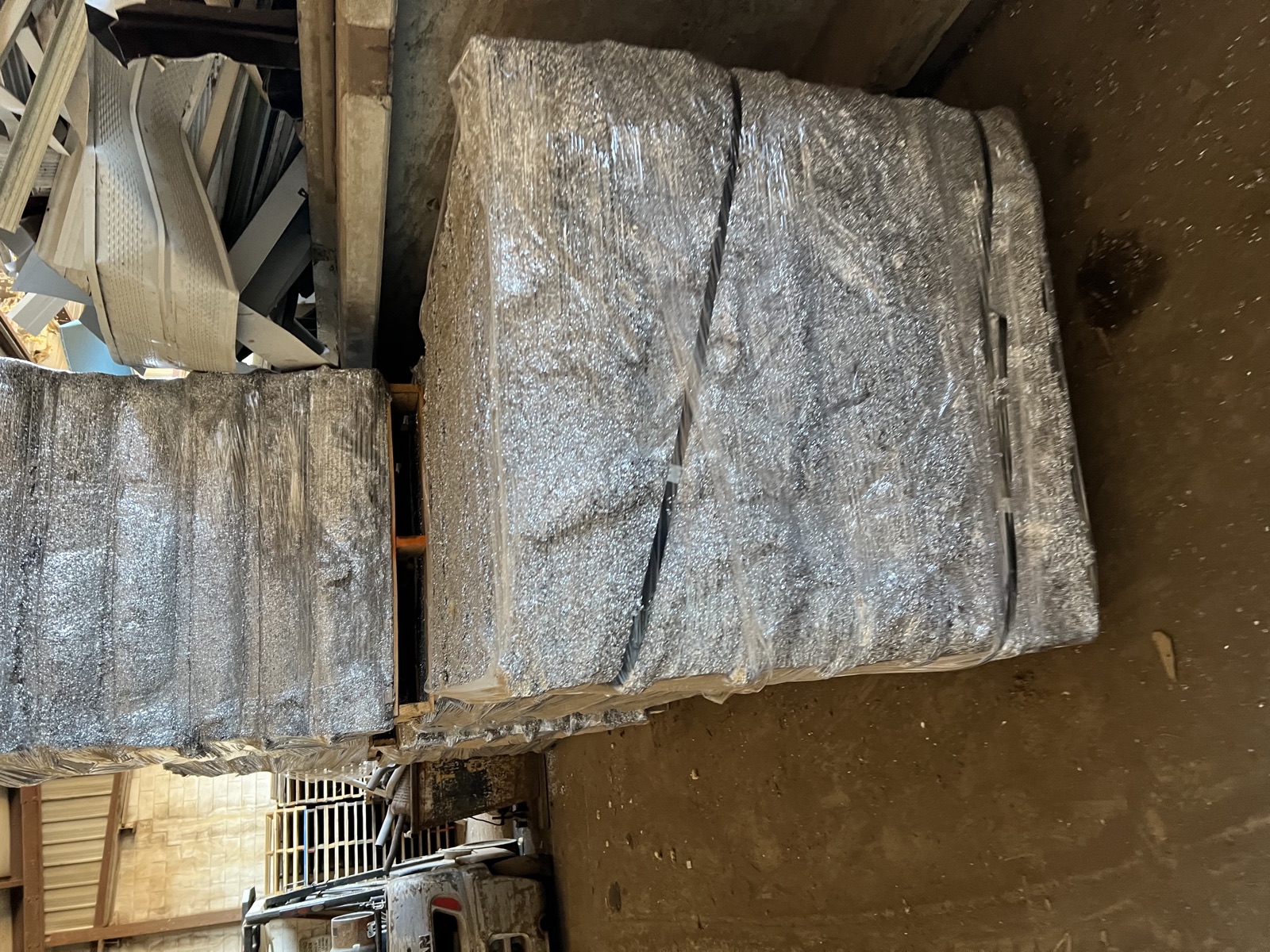 Briquetted aluminum turnings on a pallet