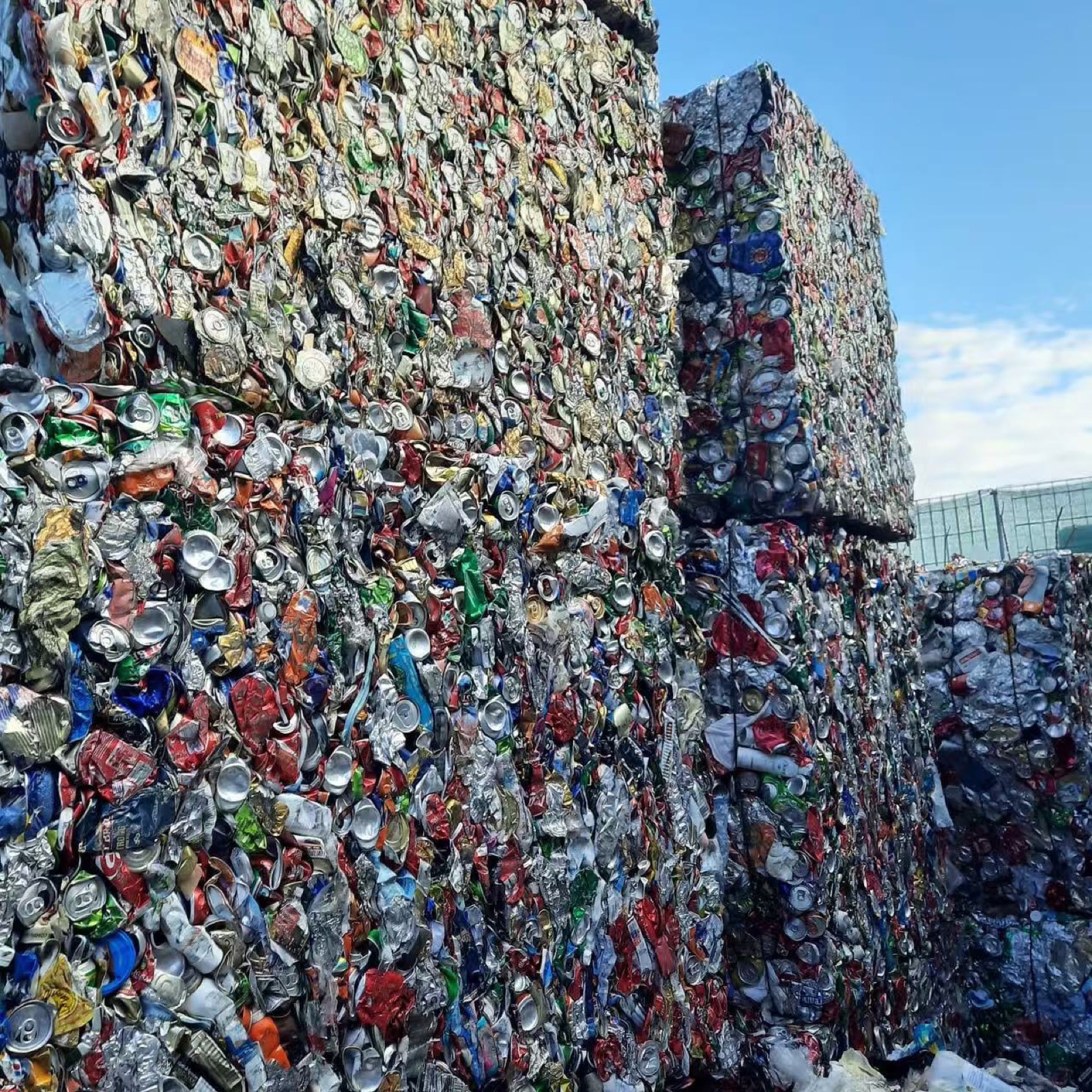 Baled aluminum cans stacked outdoors