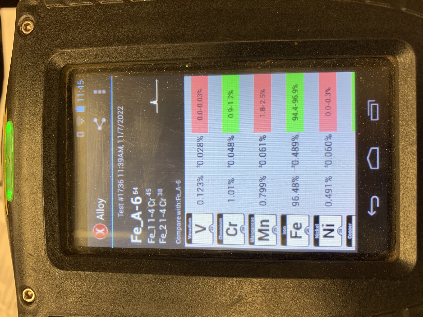 Handheld XRF analyzer reading an alloy's chemistry