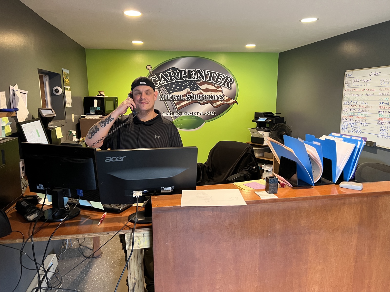 Eric Call taking a call at the scale house desk